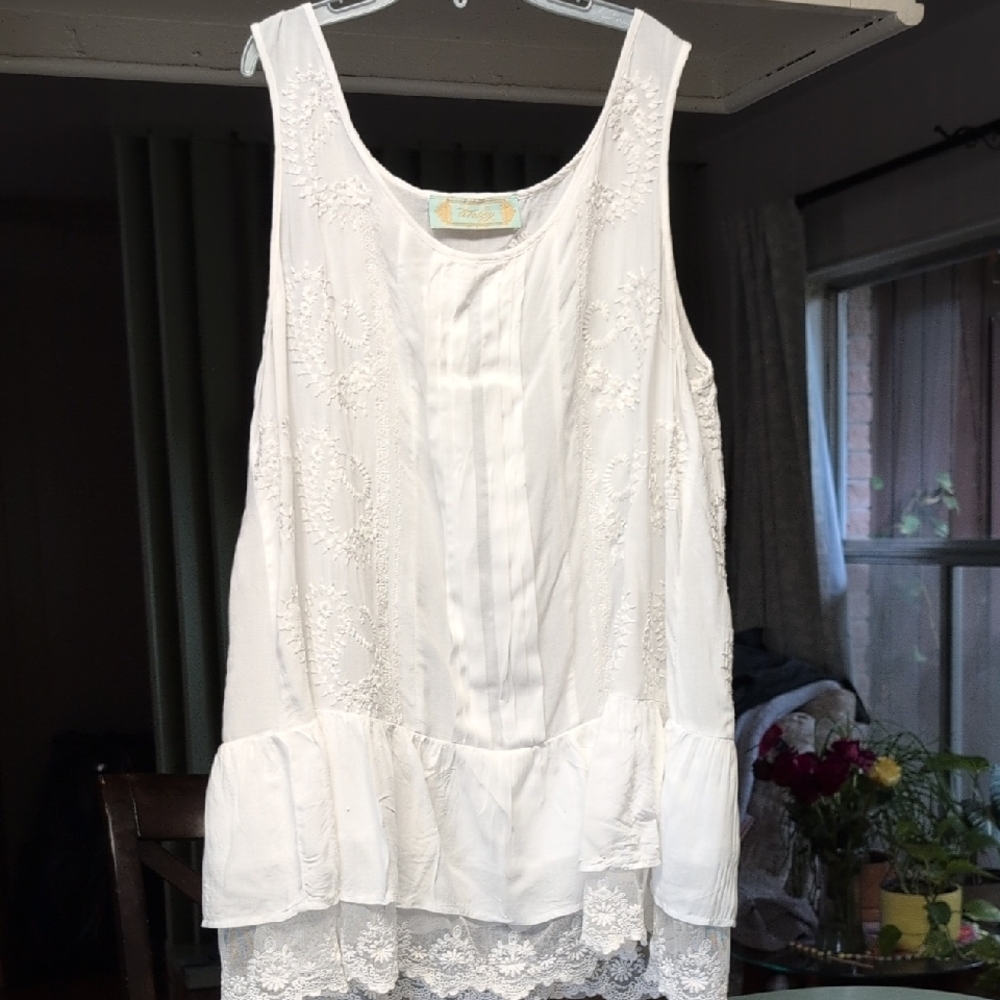White Sleeveless Blouse Tiered Design